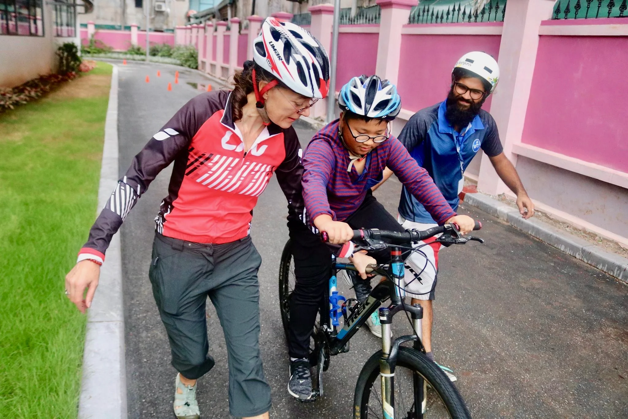Ms Michelle and Mr Prateek help a student.jpg